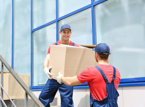 Careful loading and protection of furniture by a man with van team