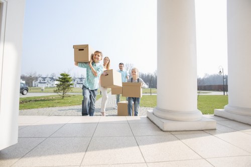 Business equipment and boxes arranged for a move in Aldboroughhatch