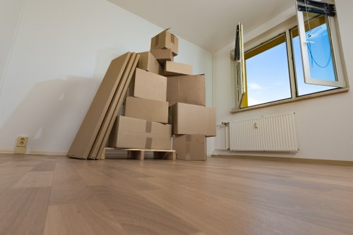 Removal van and packed boxes for a house move in Aldboroughhatch