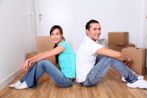Moving team handling furniture and boxes for a home relocation in Aldboroughhatch