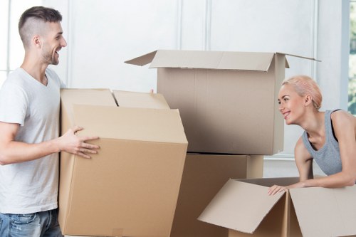 Commercial office move preparation with labelled boxes and furniture