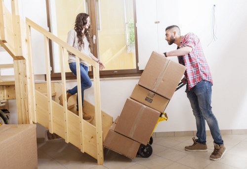 Packed boxes and furniture prepared for loading into a removals van