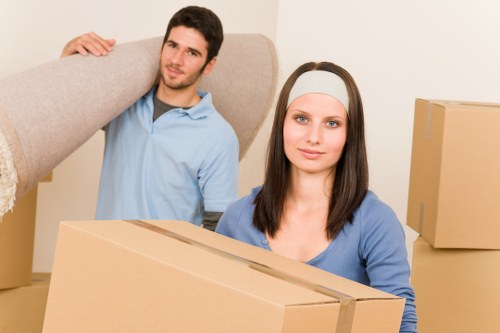Home furniture being loaded into a moving truck in Aldboroughhatch