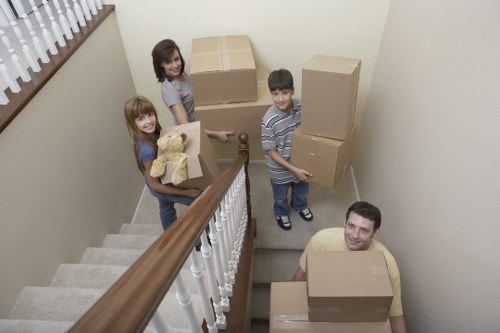 Commercial removals team preparing office equipment for transport